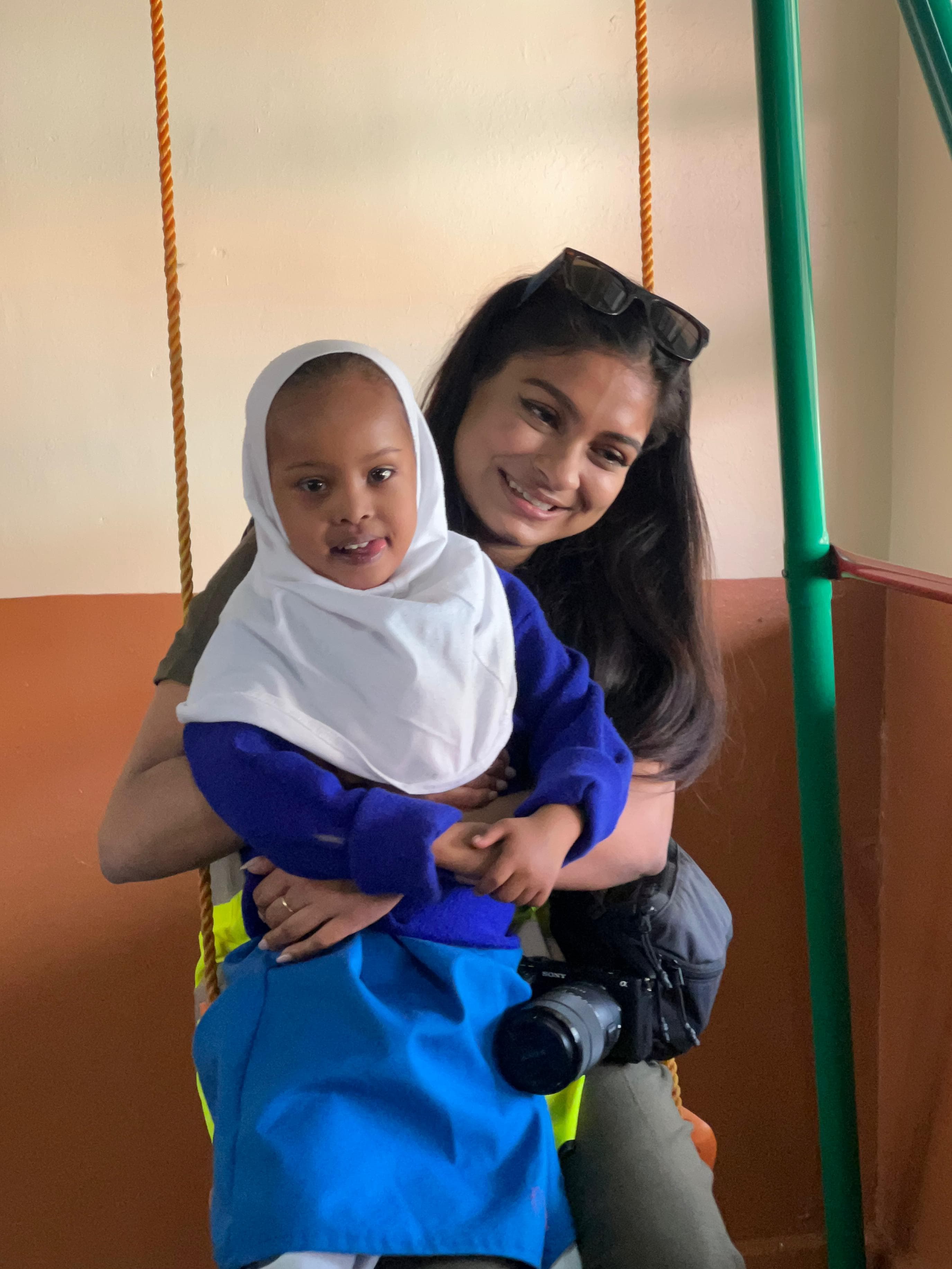 Guest with student in a touching moment