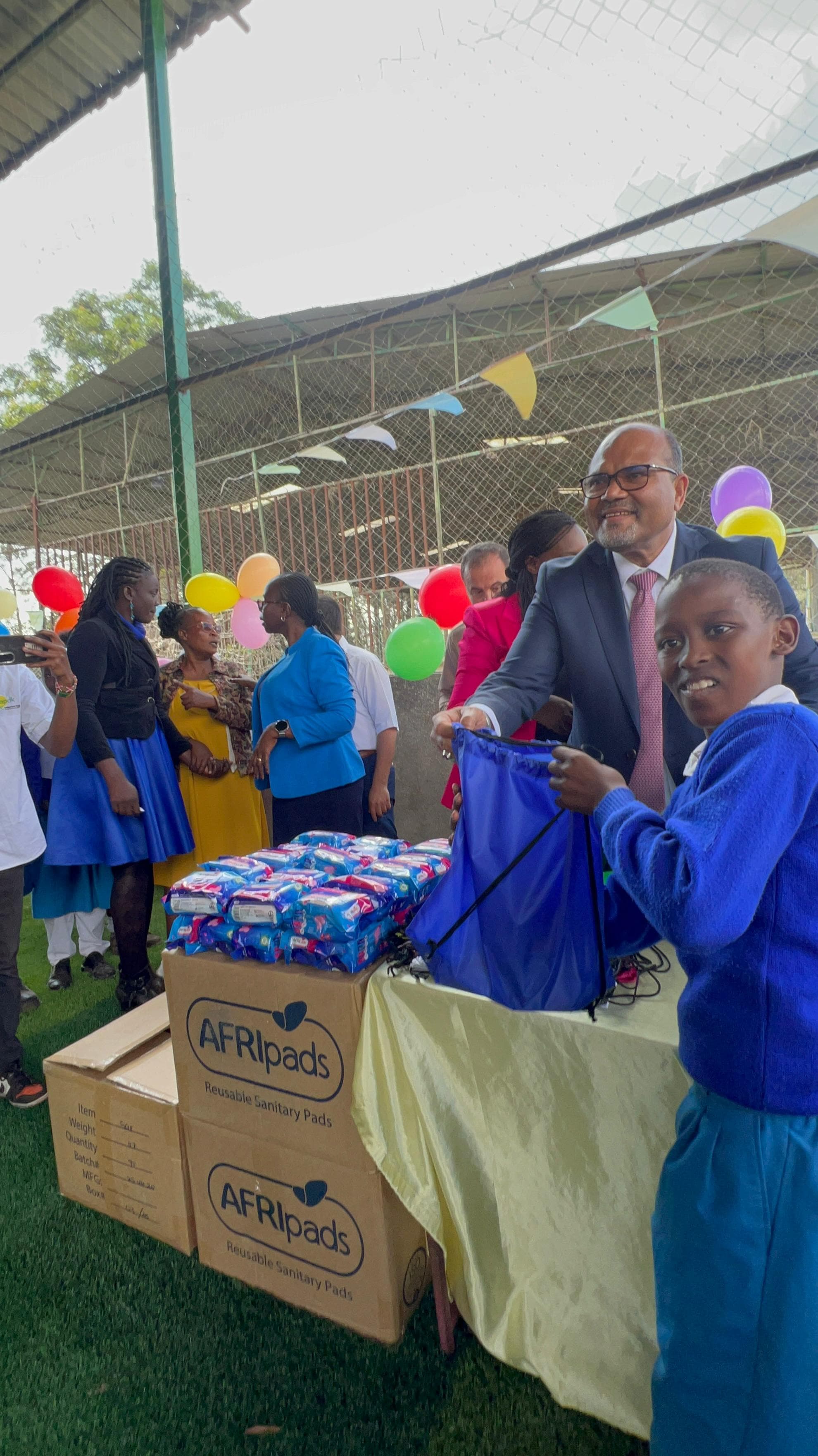 Dr. Shawn giving bags during charity event