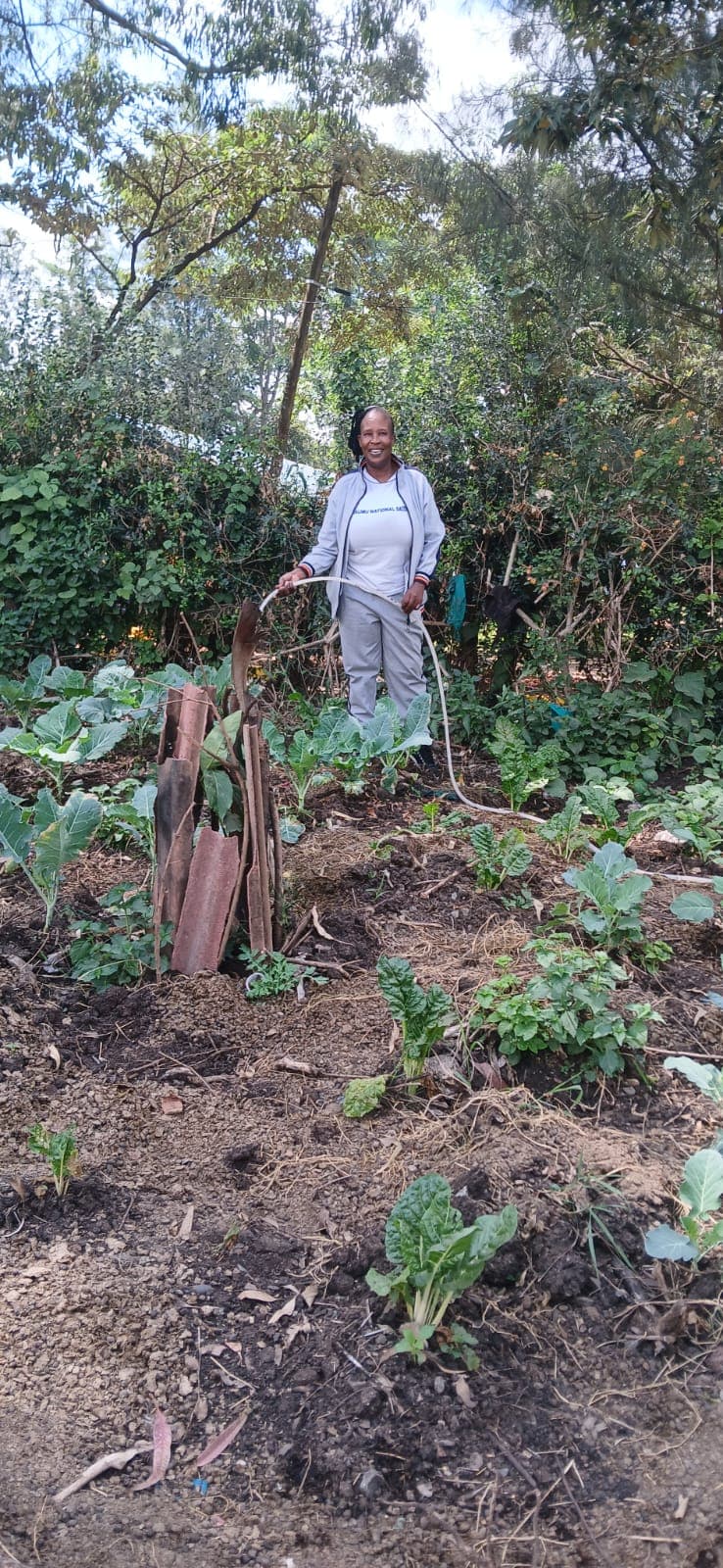 Headteacher participating in environment day activities